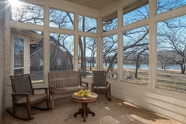 sunroom with a water view