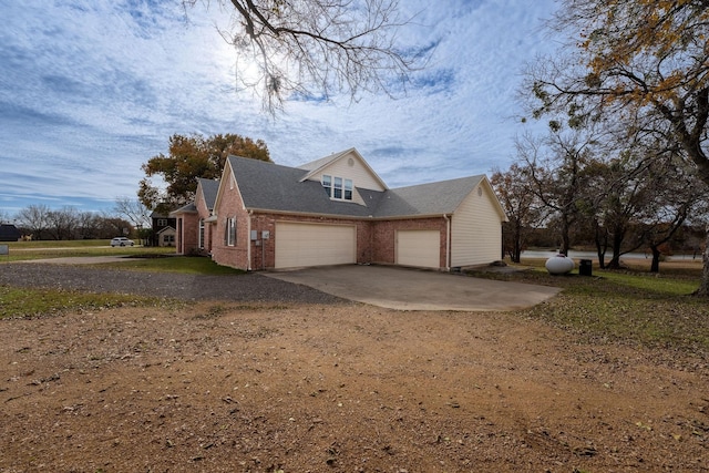 view of side of home with a garage