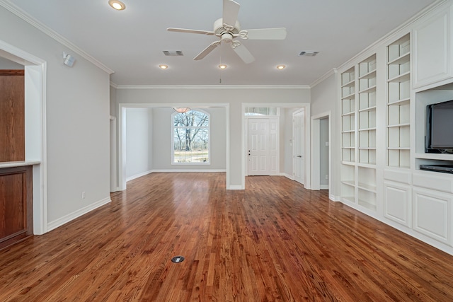 unfurnished living room featuring hardwood / wood-style floors, crown molding, built in features, and ceiling fan