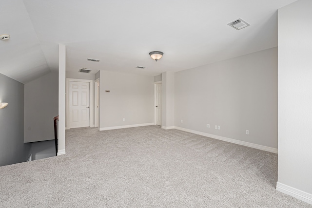 interior space with lofted ceiling and carpet flooring