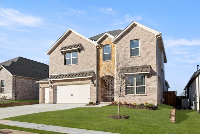 view of front of home featuring a garage, central AC, and a front lawn