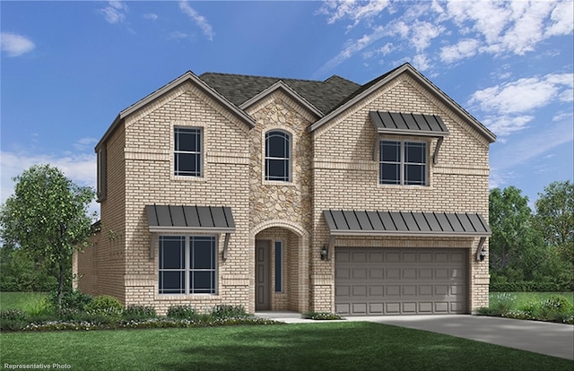 view of front of property with a front yard and a garage