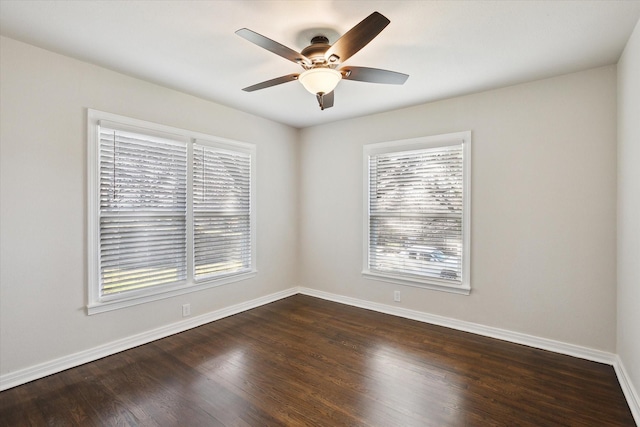 unfurnished room featuring ceiling fan and dark hardwood / wood-style floors