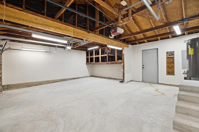 garage with water heater and a garage door opener