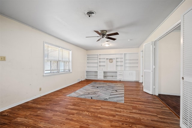 unfurnished living room featuring ceiling fan, hardwood / wood-style floors, and built in features