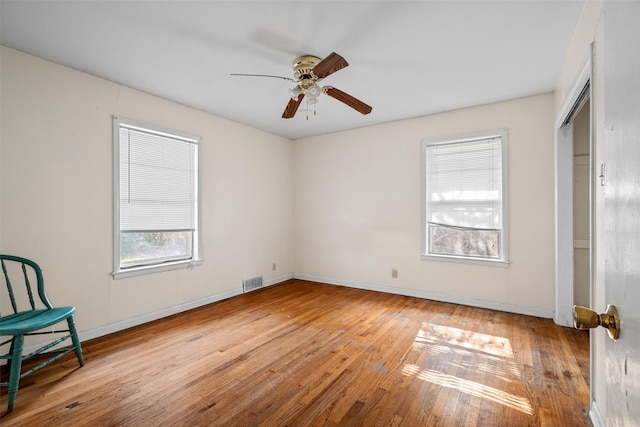 unfurnished room featuring ceiling fan and light hardwood / wood-style flooring