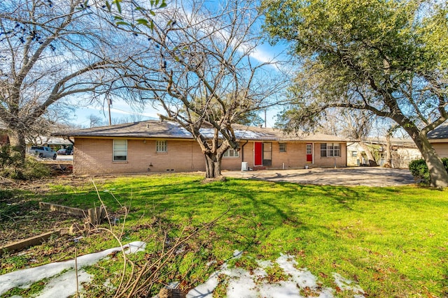 back of property featuring a yard and a patio