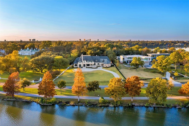 aerial view at dusk with a water view