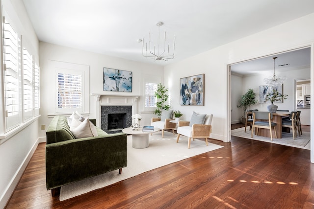 living room featuring dark wood-type flooring and a fireplace