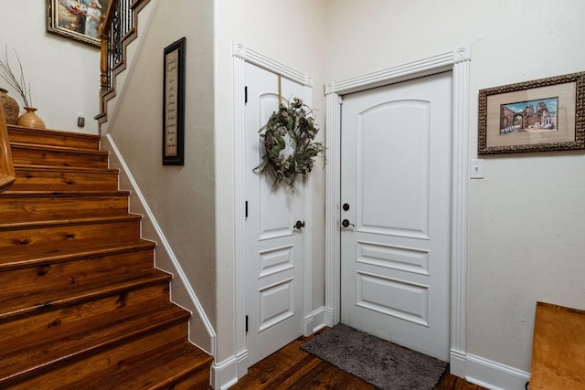 entryway with dark hardwood / wood-style floors