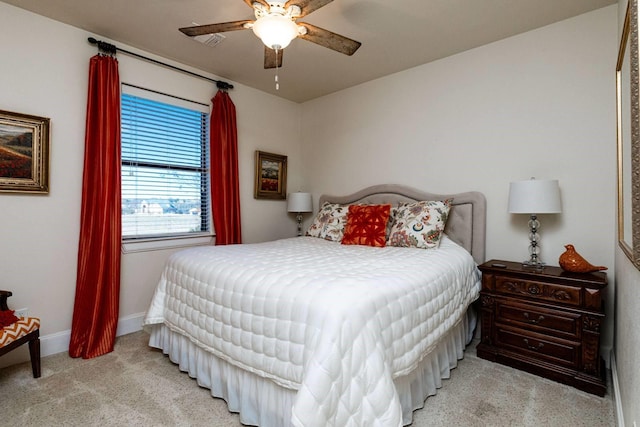 bedroom featuring ceiling fan and light colored carpet