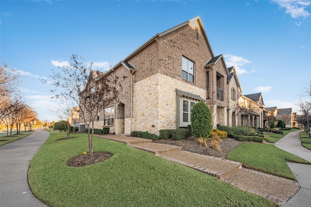 view of property exterior featuring a lawn