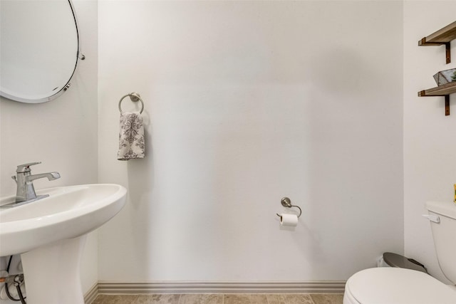 bathroom with toilet and sink