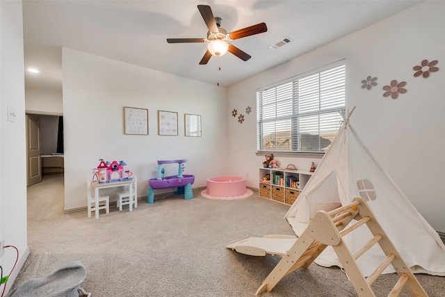 rec room with ceiling fan and carpet flooring