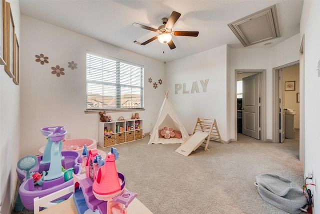 recreation room featuring ceiling fan and carpet flooring