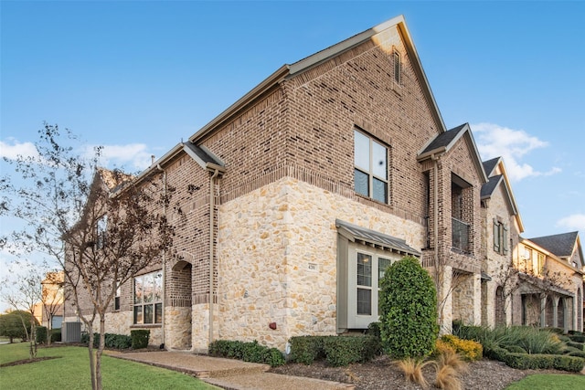 view of property exterior with a lawn