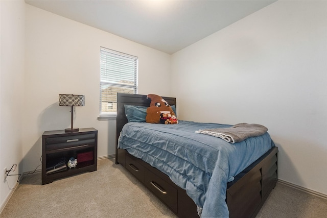 carpeted bedroom featuring lofted ceiling