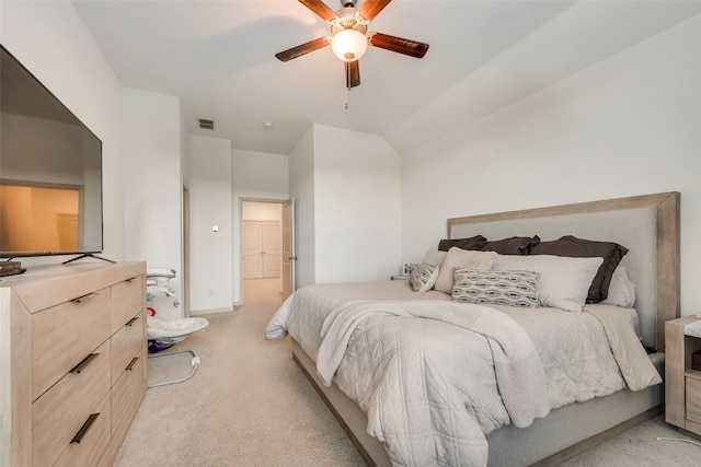 carpeted bedroom featuring vaulted ceiling and ceiling fan