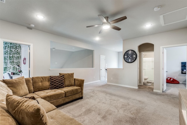 living room with light carpet and ceiling fan