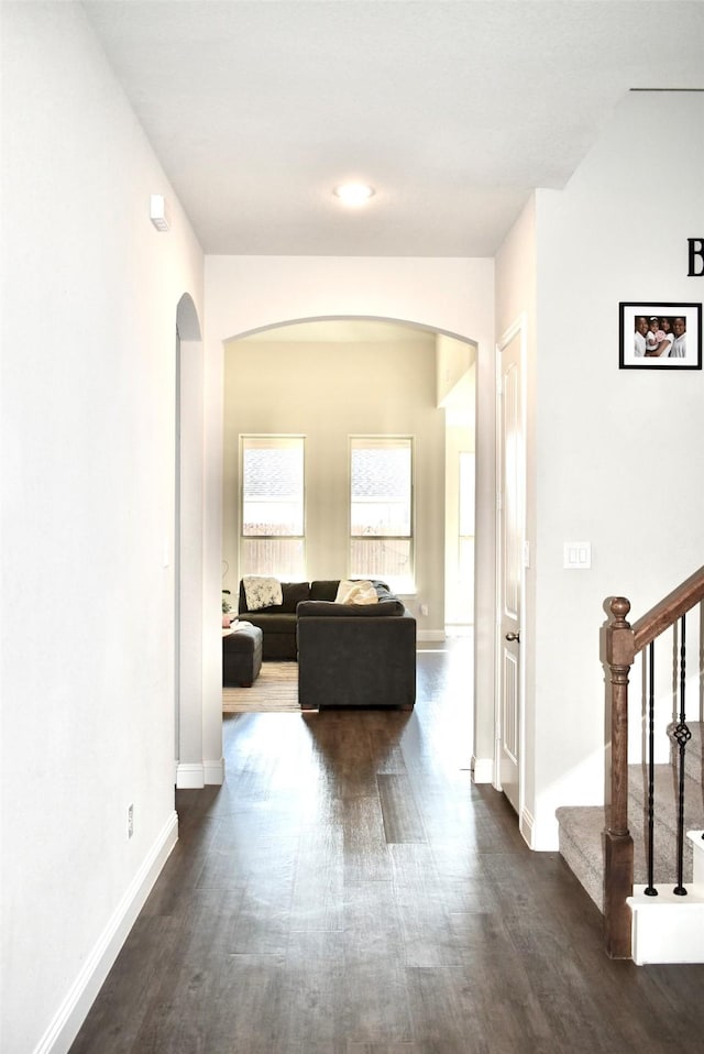 corridor with dark wood-type flooring