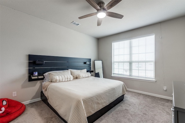 bedroom with ceiling fan and carpet flooring