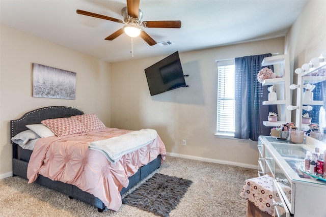 bedroom with ceiling fan and light colored carpet