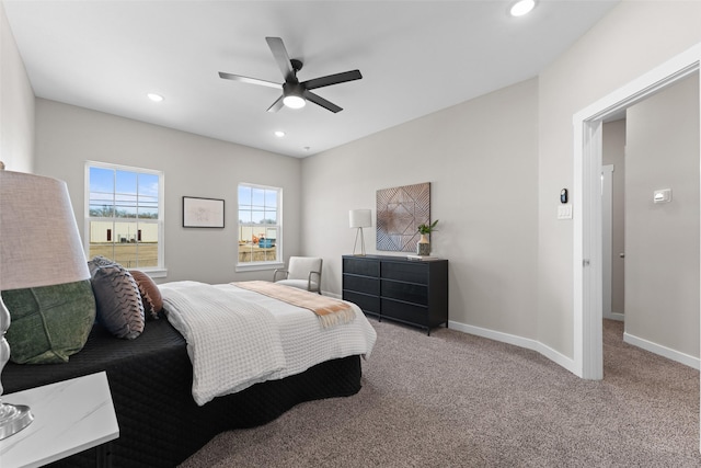 bedroom featuring light carpet, recessed lighting, and baseboards