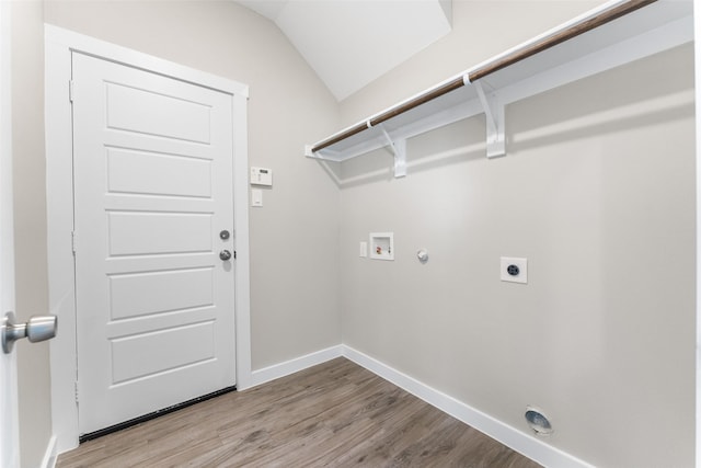 clothes washing area featuring laundry area, baseboards, light wood-style flooring, hookup for an electric dryer, and washer hookup