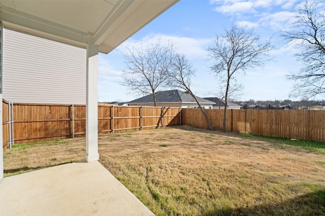 view of yard featuring a fenced backyard and a patio