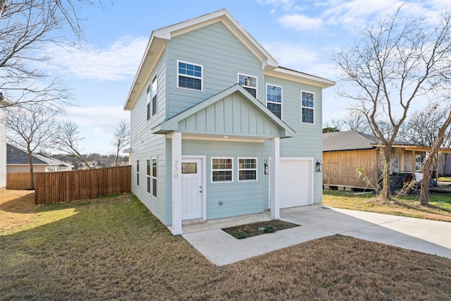 view of front of property with a front lawn and a garage