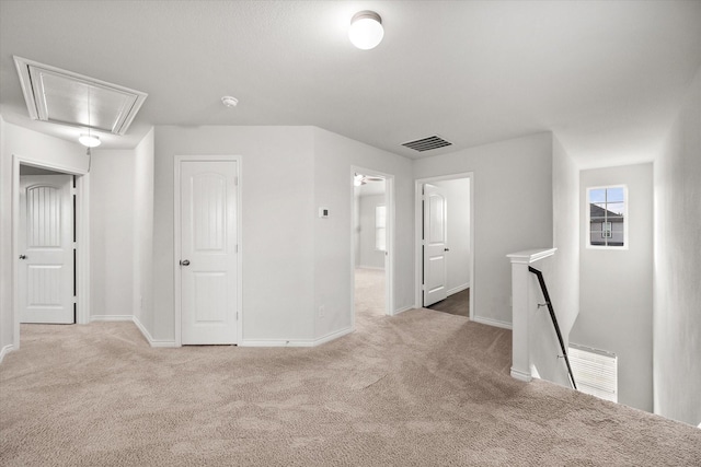 interior space featuring light colored carpet