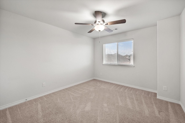 unfurnished room featuring ceiling fan and carpet flooring