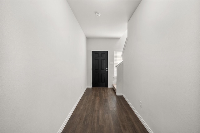 hall with dark wood-type flooring