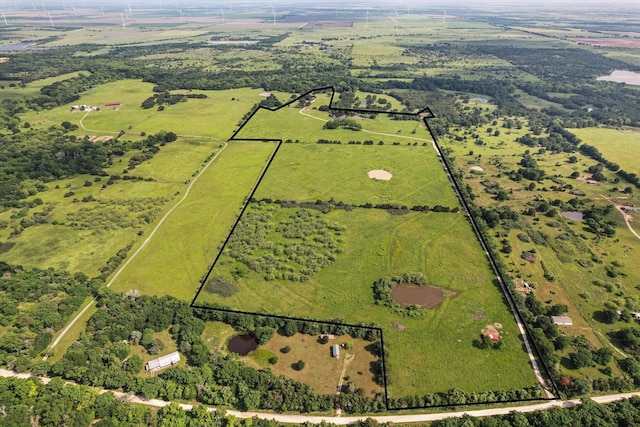 birds eye view of property featuring a rural view