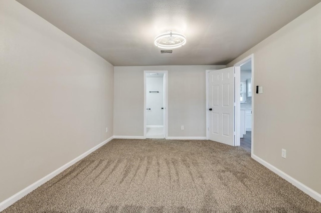 empty room featuring carpet floors