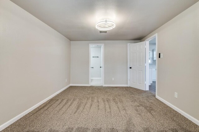 empty room with carpet and ceiling fan