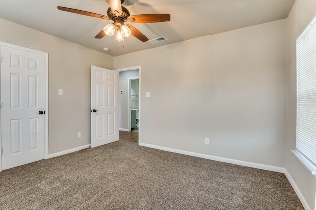 unfurnished bedroom featuring ceiling fan and carpet flooring