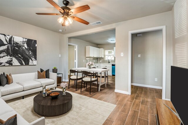 entrance foyer featuring ceiling fan and light hardwood / wood-style flooring