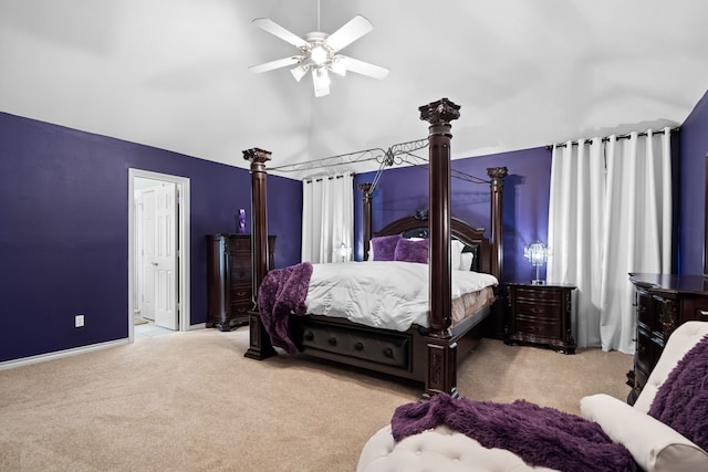 bedroom with a ceiling fan, light carpet, vaulted ceiling, and baseboards