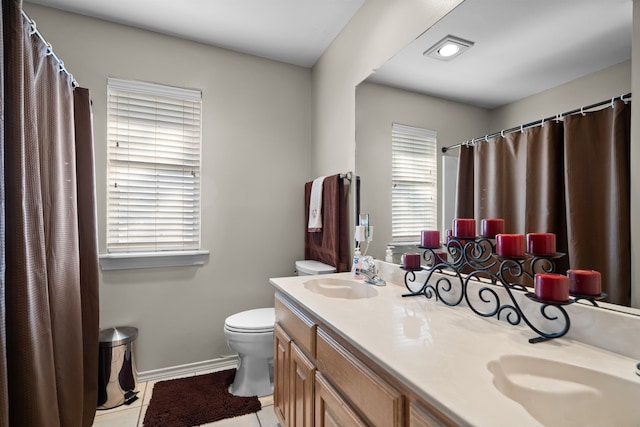 bathroom featuring a bath, visible vents, a shower stall, double vanity, and tile patterned flooring