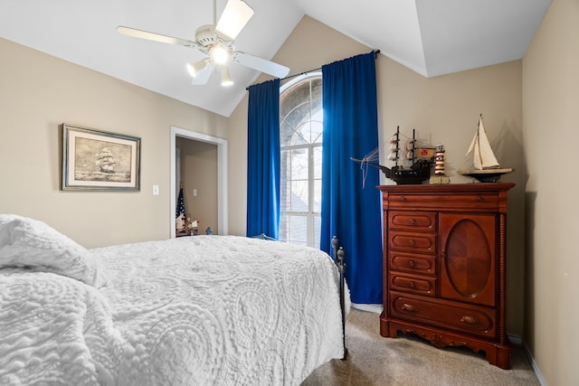 bedroom with lofted ceiling, ceiling fan, carpet floors, and baseboards