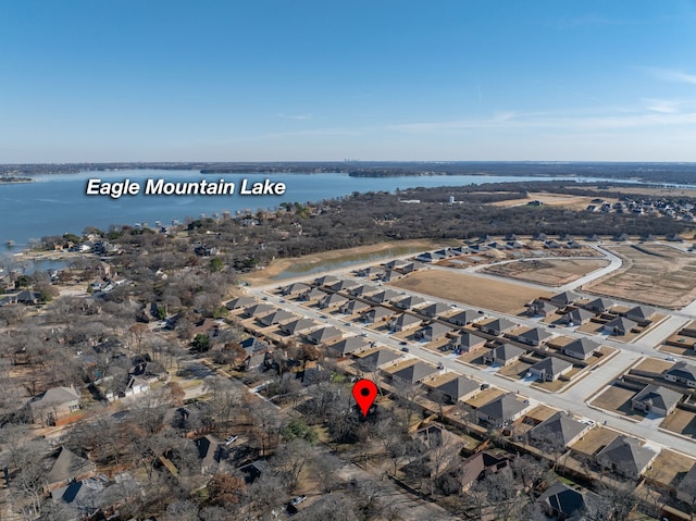 bird's eye view with a water view and a residential view