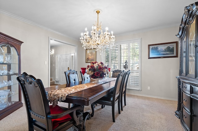 dining area featuring ornamental molding, light colored carpet, a notable chandelier, and baseboards