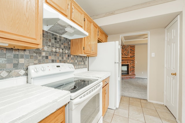 kitchen featuring backsplash, a brick fireplace, white range with electric cooktop, light brown cabinets, and light carpet