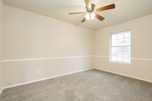 unfurnished room with ceiling fan and carpet floors