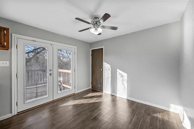 spare room featuring ceiling fan, dark hardwood / wood-style flooring, and french doors