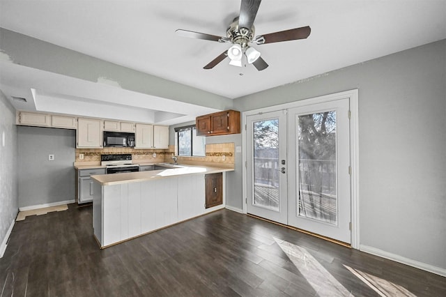 kitchen featuring ceiling fan, decorative backsplash, sink, range with electric cooktop, and french doors