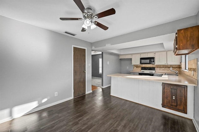 kitchen with range with electric cooktop, ceiling fan, tasteful backsplash, dark wood-type flooring, and sink