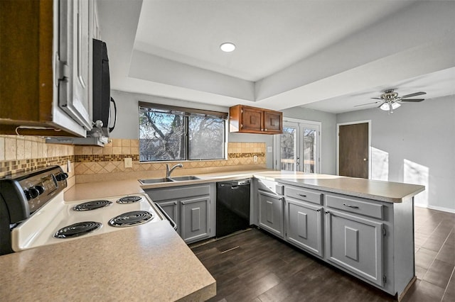 kitchen featuring kitchen peninsula, gray cabinetry, dishwasher, electric range oven, and sink