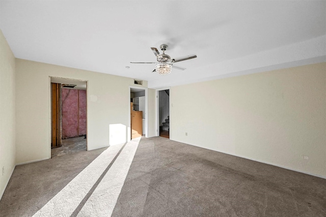 carpeted spare room with ceiling fan